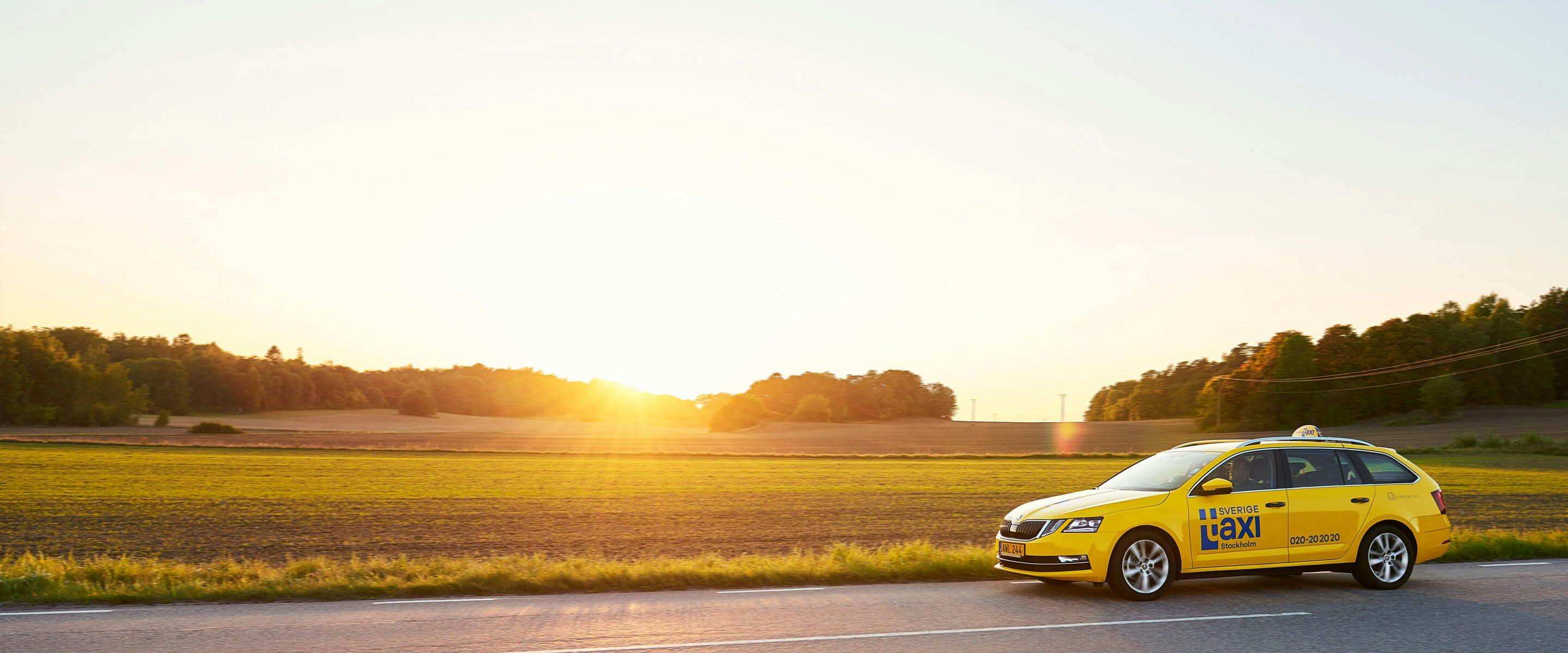 Cab driving on the road in a sunset